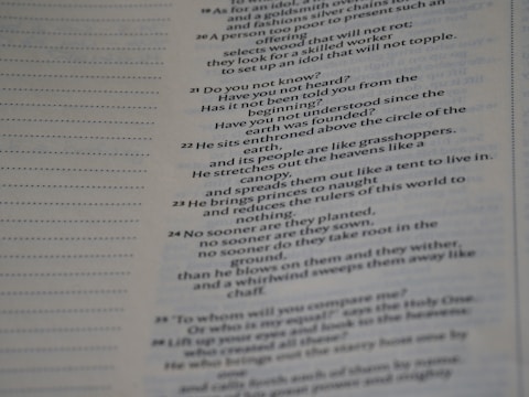 Text from a book is displayed across the right side of a page, with a margin of dotted lines on the left. The text appears to be a passage, possibly from a religious or philosophical work.