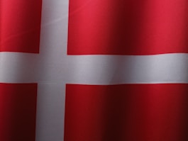 a close up of a red and white flag