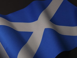 a close up of a blue and white flag