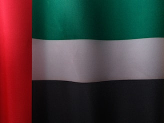 a close up of a red, white, and green flag
