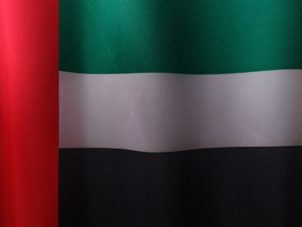 a close up of a red, white, and green flag