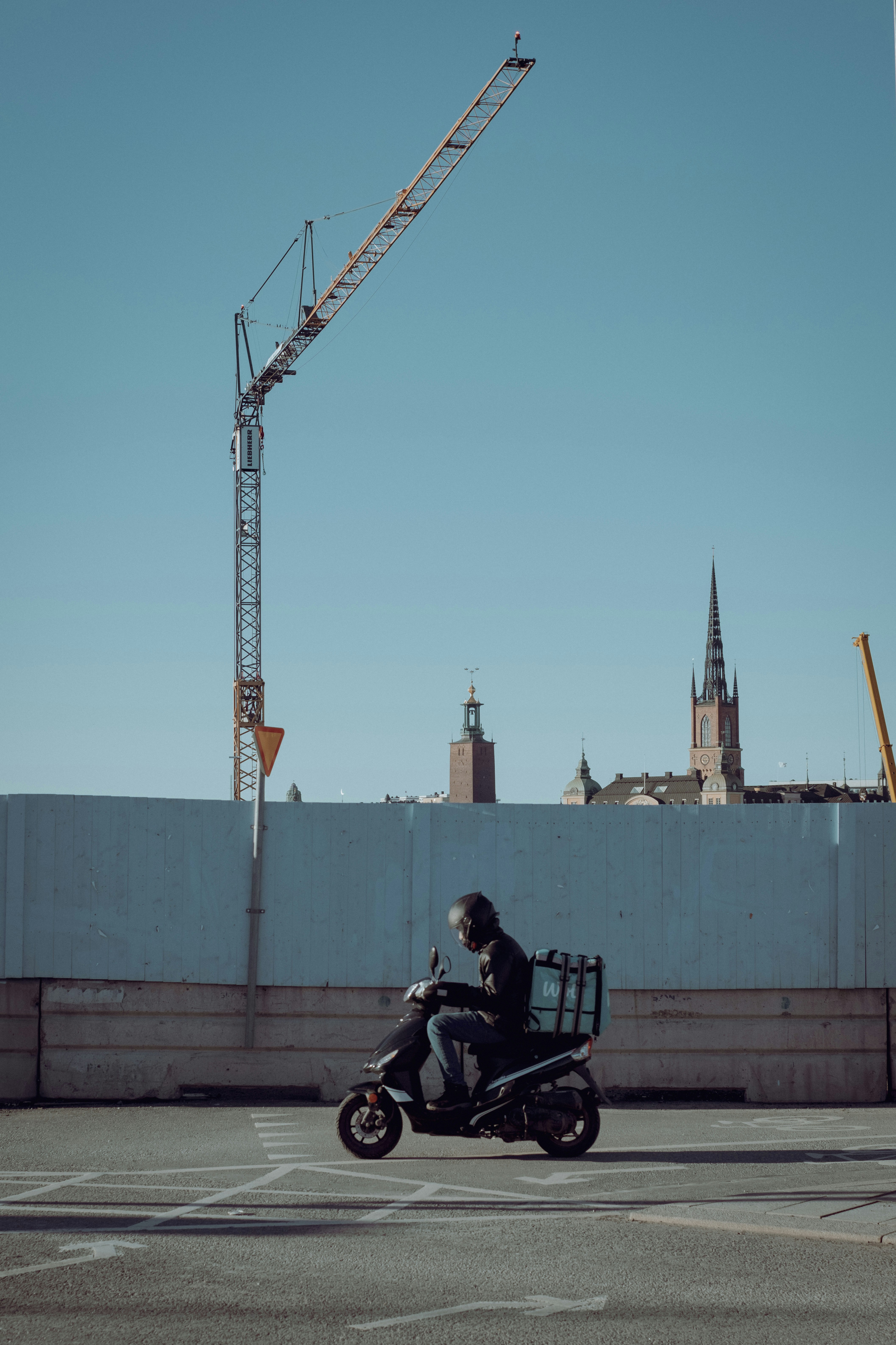 a man riding a motorcycle on a city street