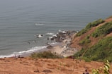 A scenic view of an island with people enjoying nature.