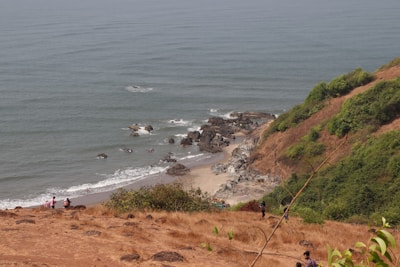 A scenic view of an island with people enjoying nature.