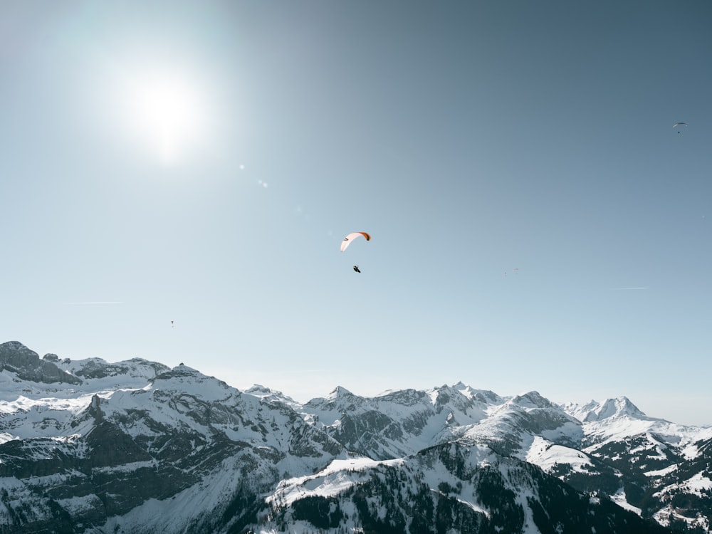 a person flying a kite high in the sky