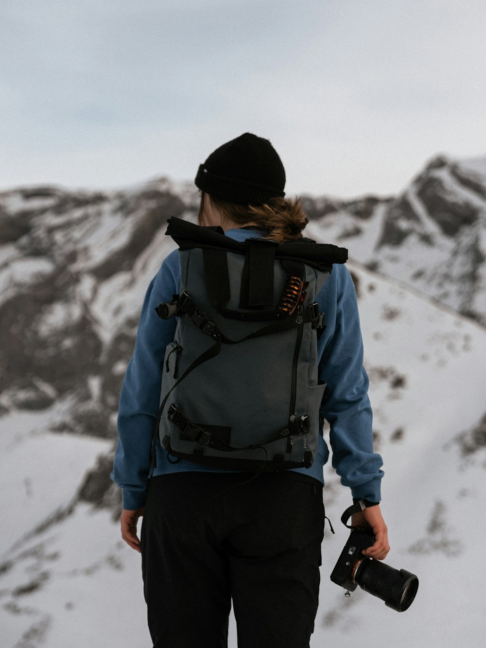 a person with a backpack and a camera