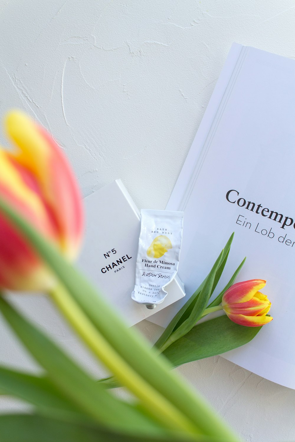 a close up of a flower near a book