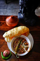a plate of food with bread and beans