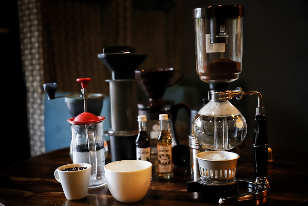 a coffee maker sitting on top of a wooden table