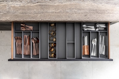 a shelf filled with lots of different types of utensils