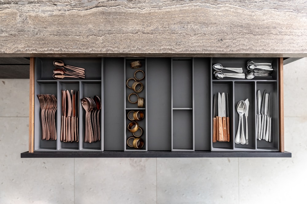 a shelf filled with lots of different types of utensils