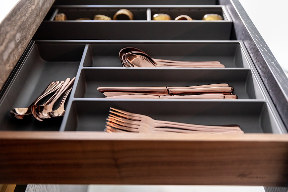 a drawer filled with lots of different types of utensils