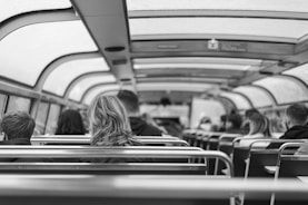 A group of travelers comfortably seated inside a spacious vehicle.