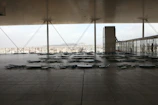 Wide shot of the terrace showcasing minimalist design and greenery.