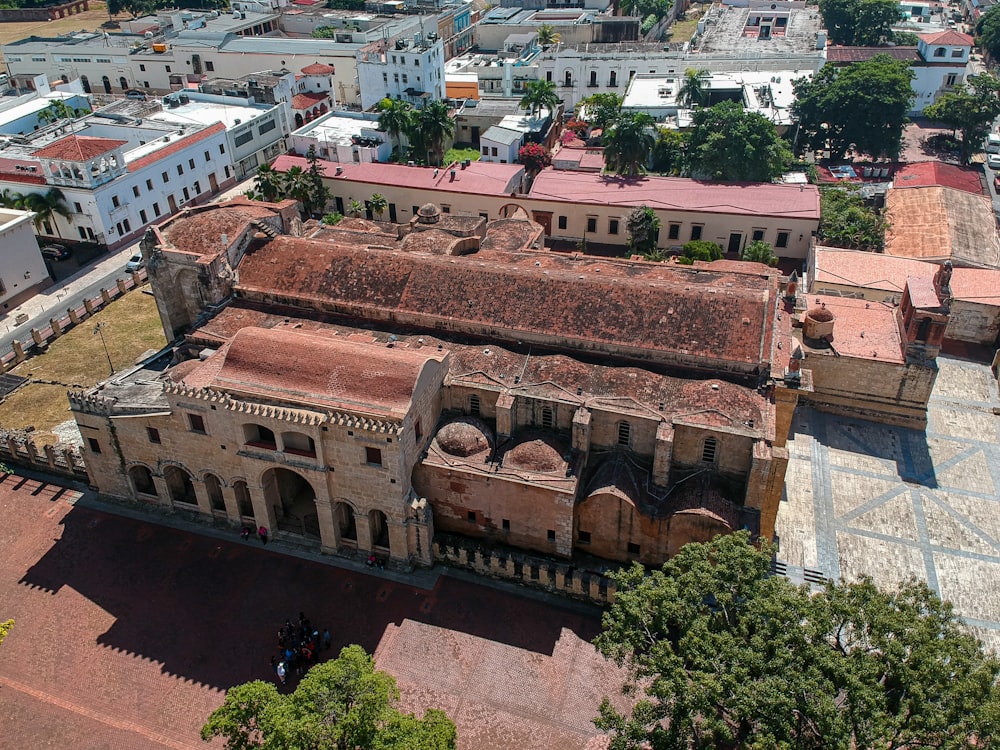 an aerial view of a large building with a red roof