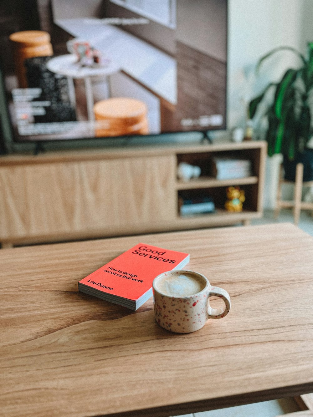 a coffee cup sitting on top of a wooden table