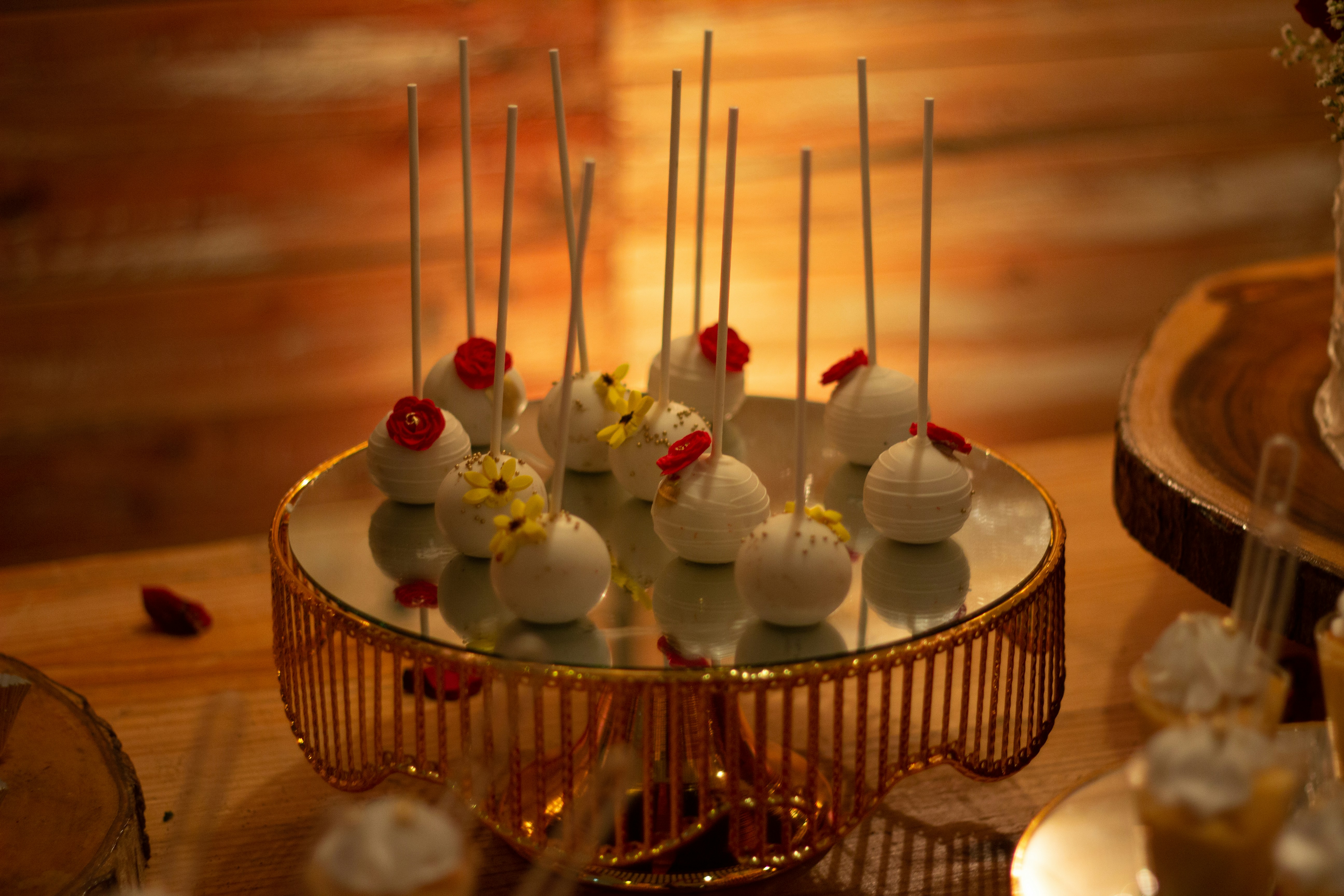 a table topped with a cake covered in white frosting