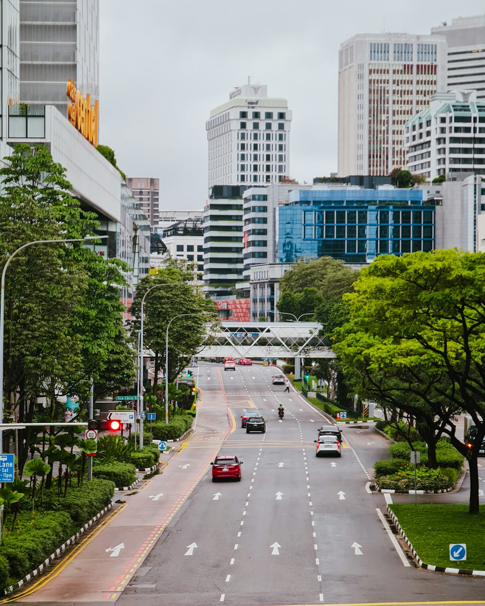 a city street with cars driving down it