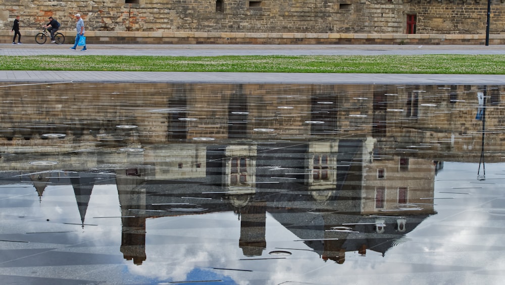 a reflection of a building in the water