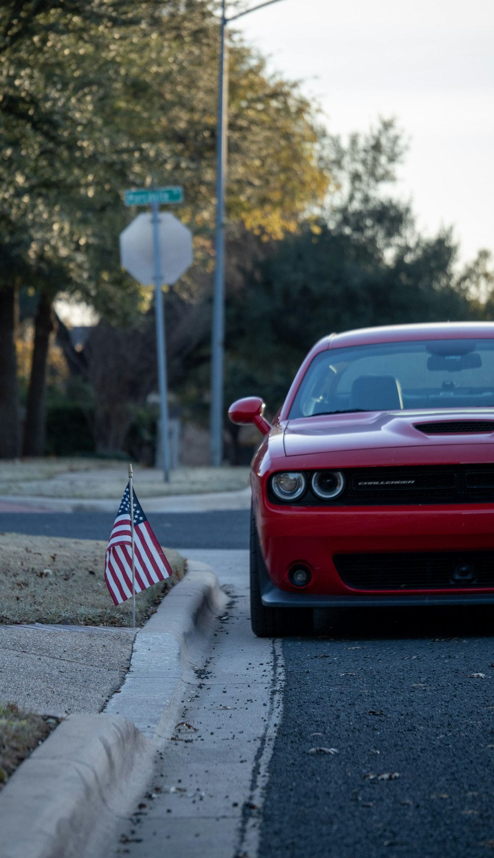 a red car parked on the side of the road