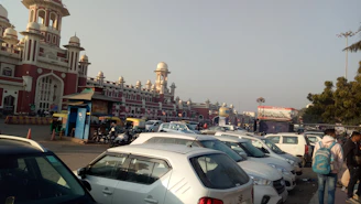 The wide parking area outside The Royal Siddhatva Grand on a sunny day.