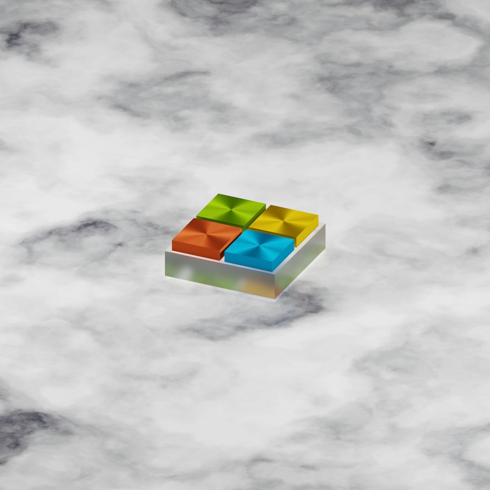 a colorful cube floating in the air on a cloudy day