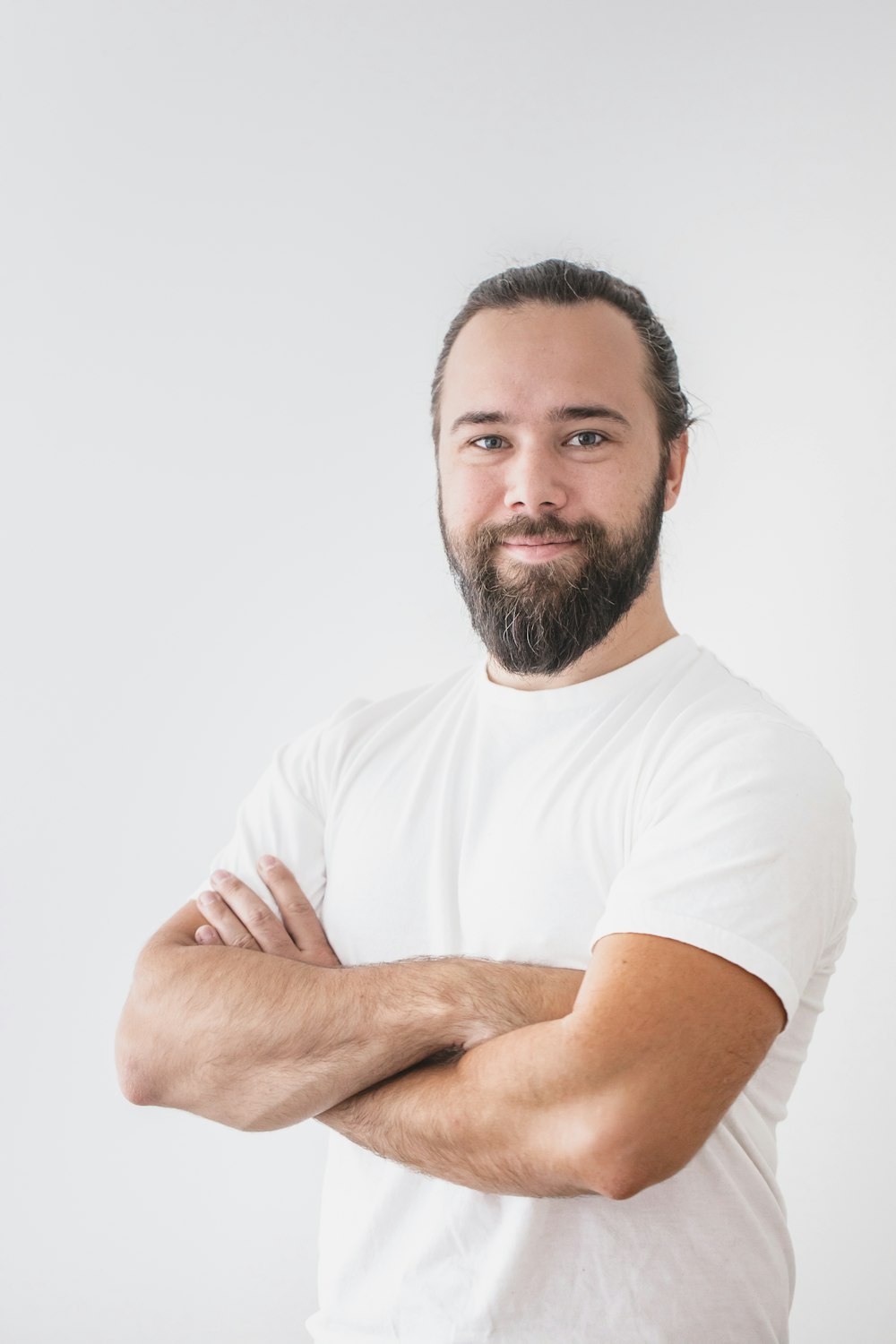 a man with a beard and white shirt