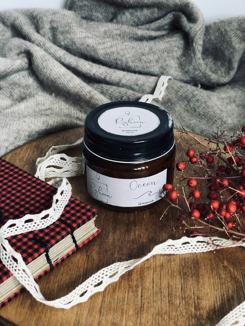 a jar of cream sitting on top of a wooden table