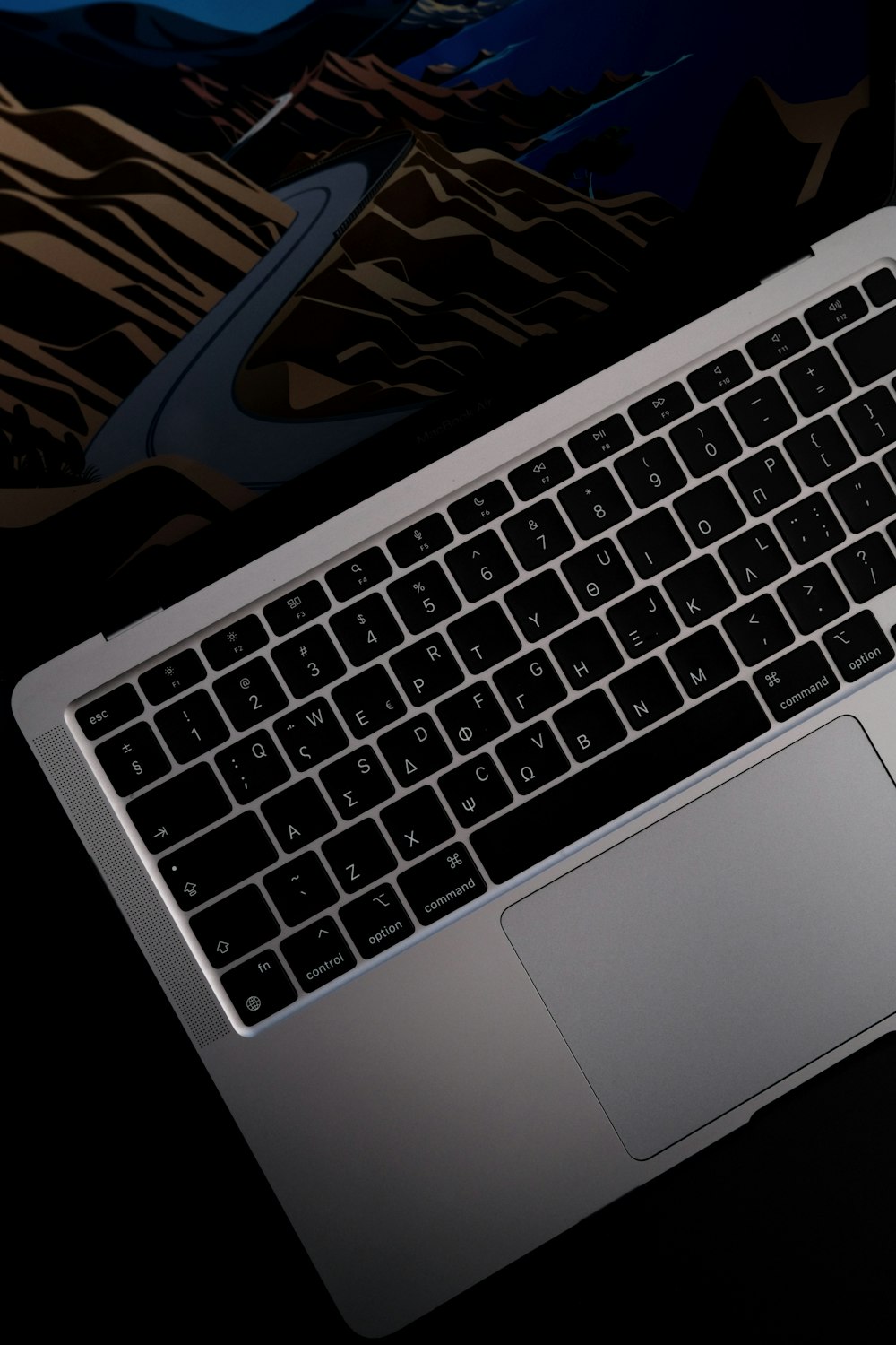 a laptop computer sitting on top of a desk