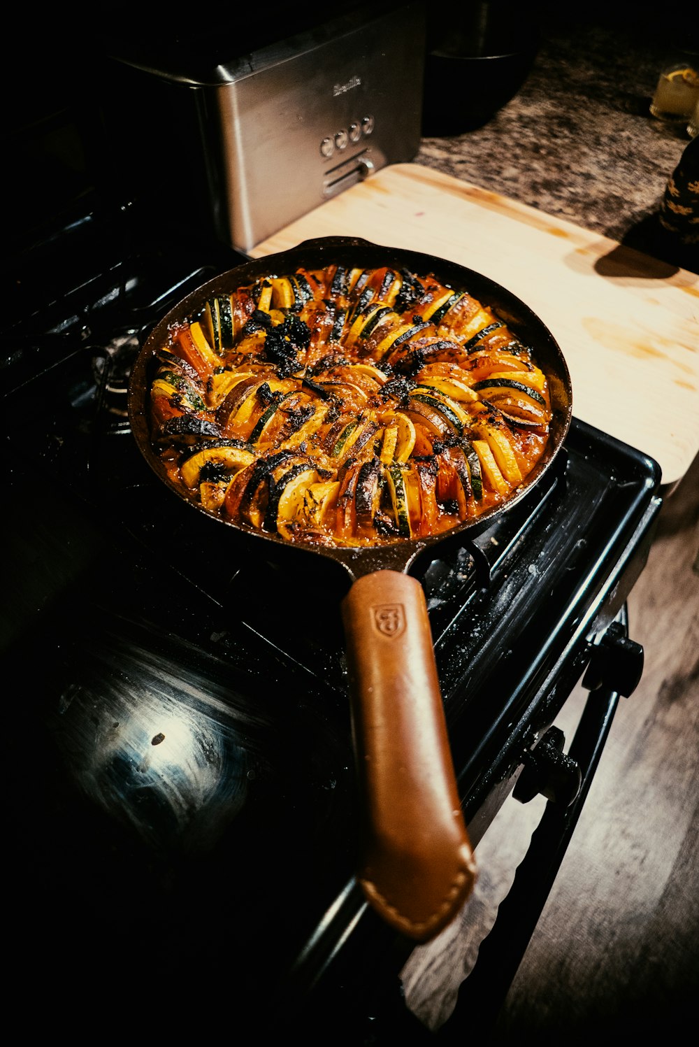 a pan of food sitting on top of an oven