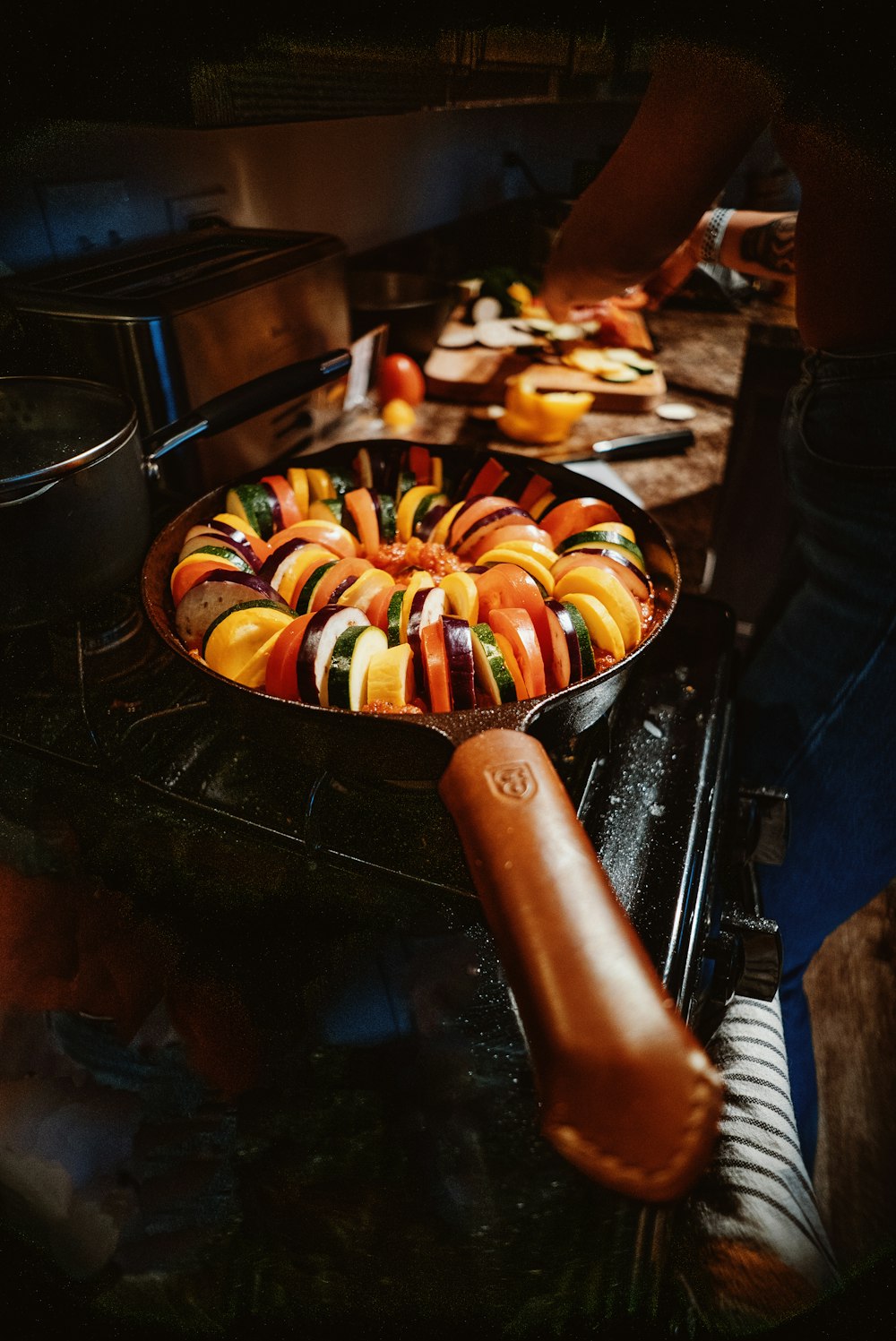 a pan filled with colorful candy sitting on top of a stove
