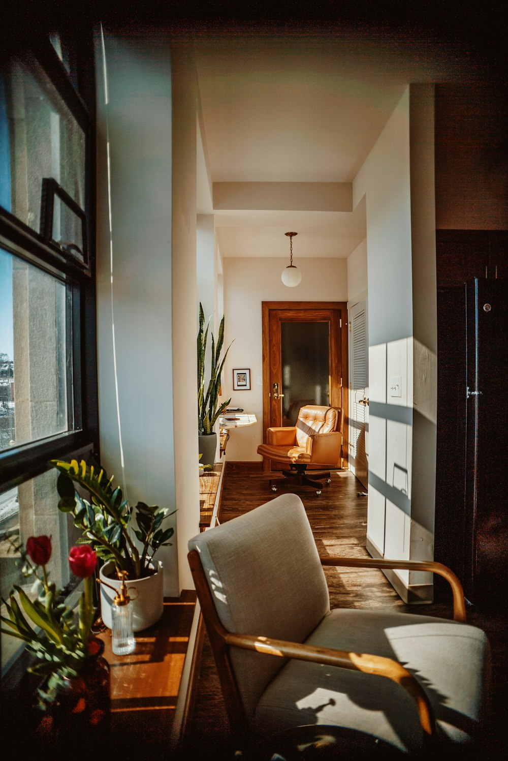 a living room filled with furniture and a large window