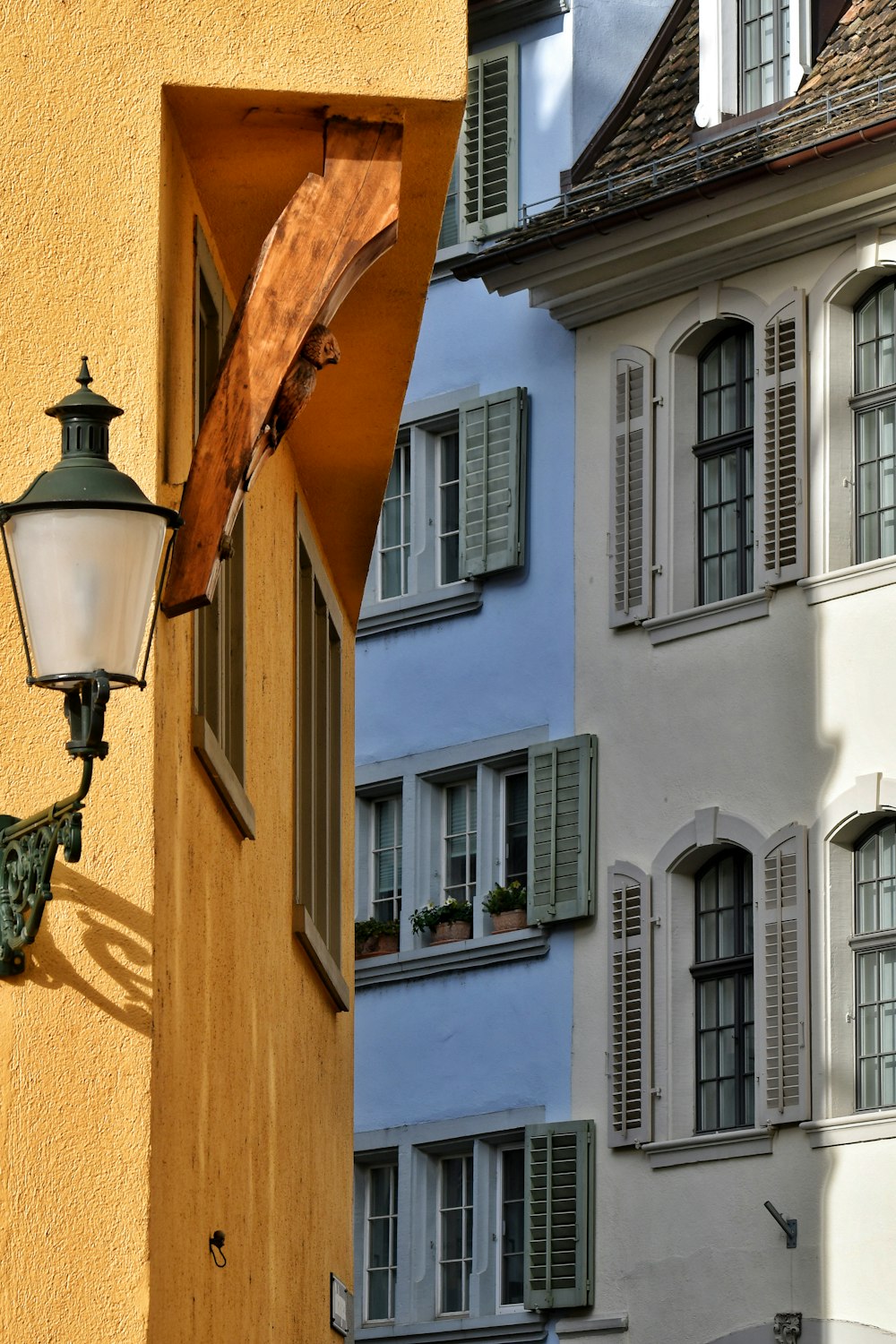 a lamp on the side of a building