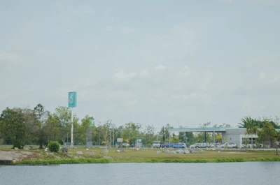 A wide shot of a completed gas station surrounded by landscaped greenery.
