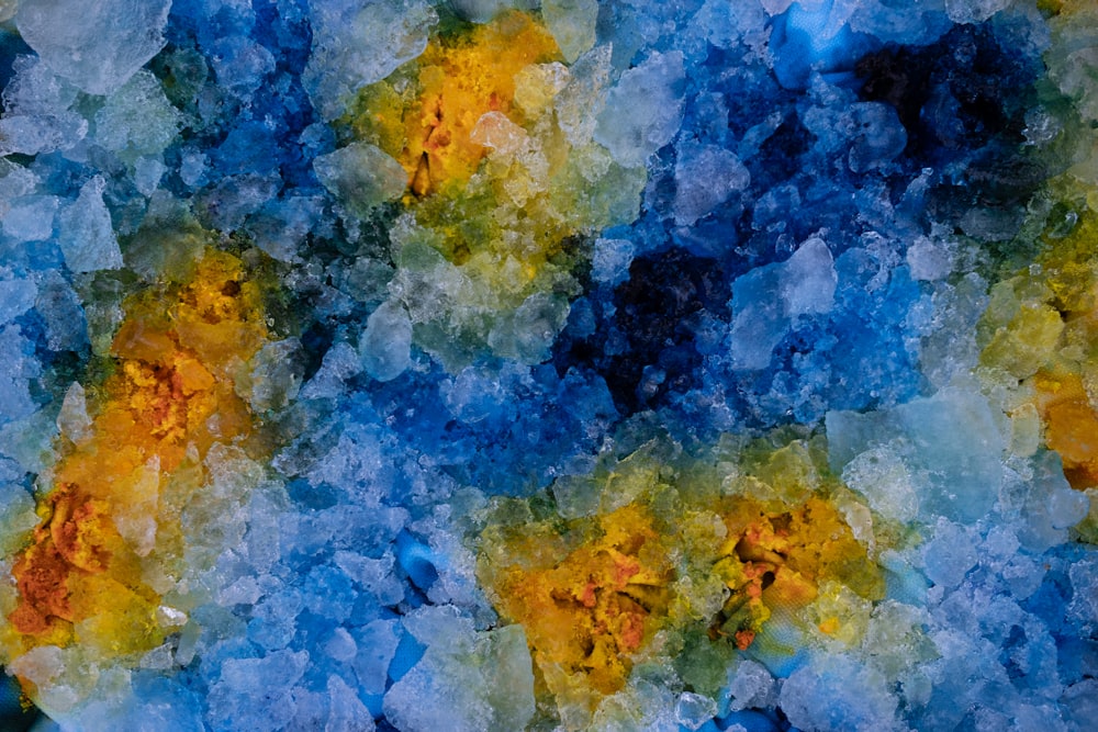 a painting of blue, yellow, and green colors
