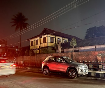 Nighttime view of a home powered by solar with backup battery lighting up the yard.