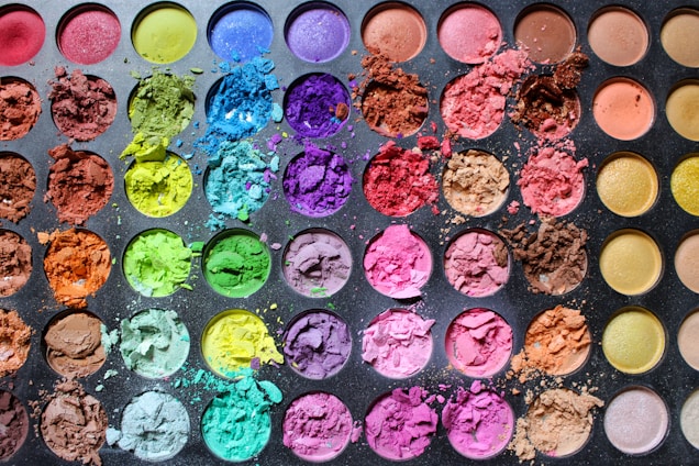 a palette of different colored powders on a table