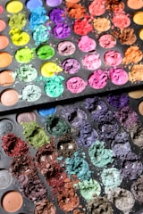An array of vibrant eye shadow palettes showcasing different colors.