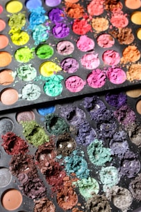An array of vibrant eye shadow palettes showcasing different colors.