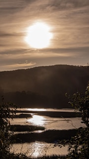 A peaceful landscape with a glowing sunset, symbolizing blessings.