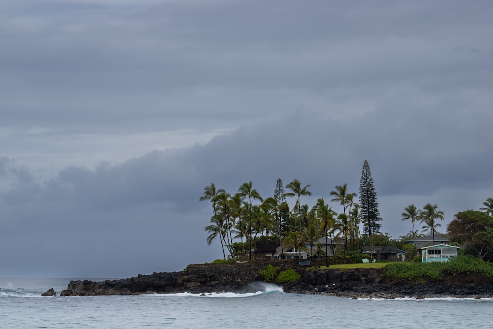 a house on a small island in the middle of the ocean