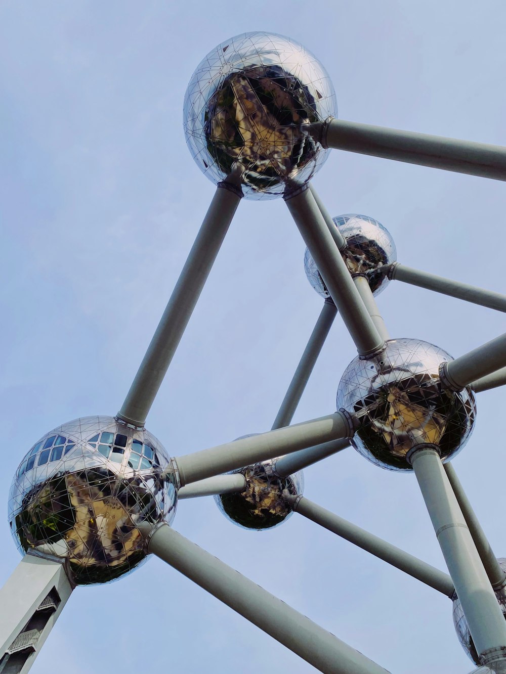 a metal structure with mirrored balls on it