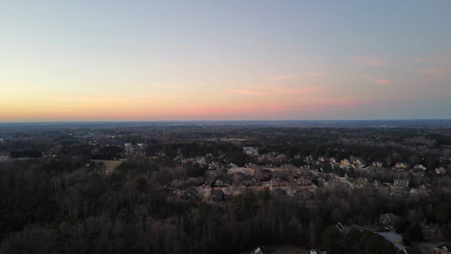 A panoramic shot of a residential neighborhood developed by nekaar at sunset.