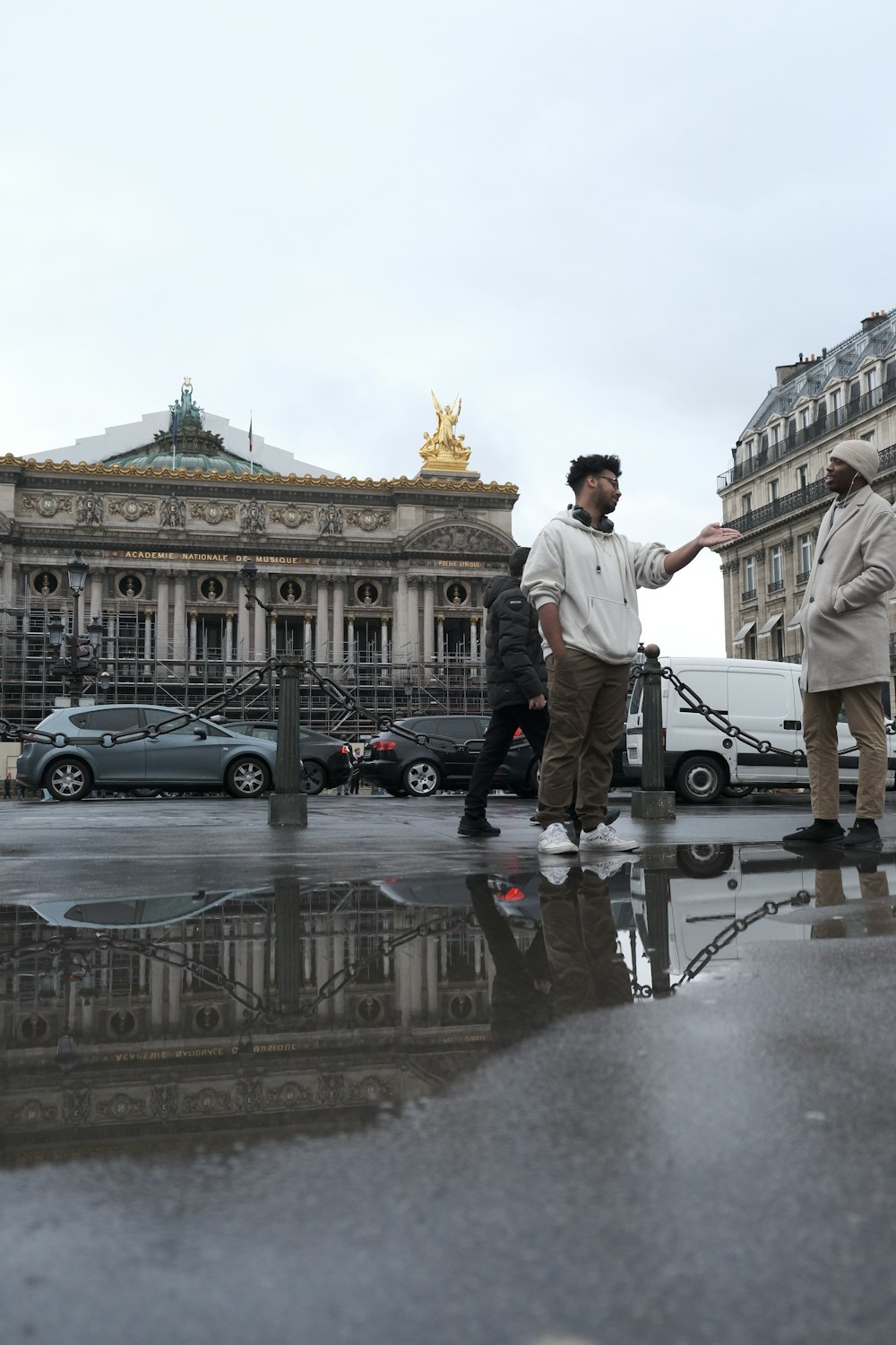 a couple of men standing next to each other