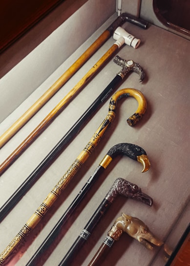 Close-up of colorful ergonomic walking canes arranged neatly on display.