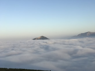 A serene landscape featuring a tranquil mountain range under a clear blue sky, symbolizing connection to nature and spirituality.