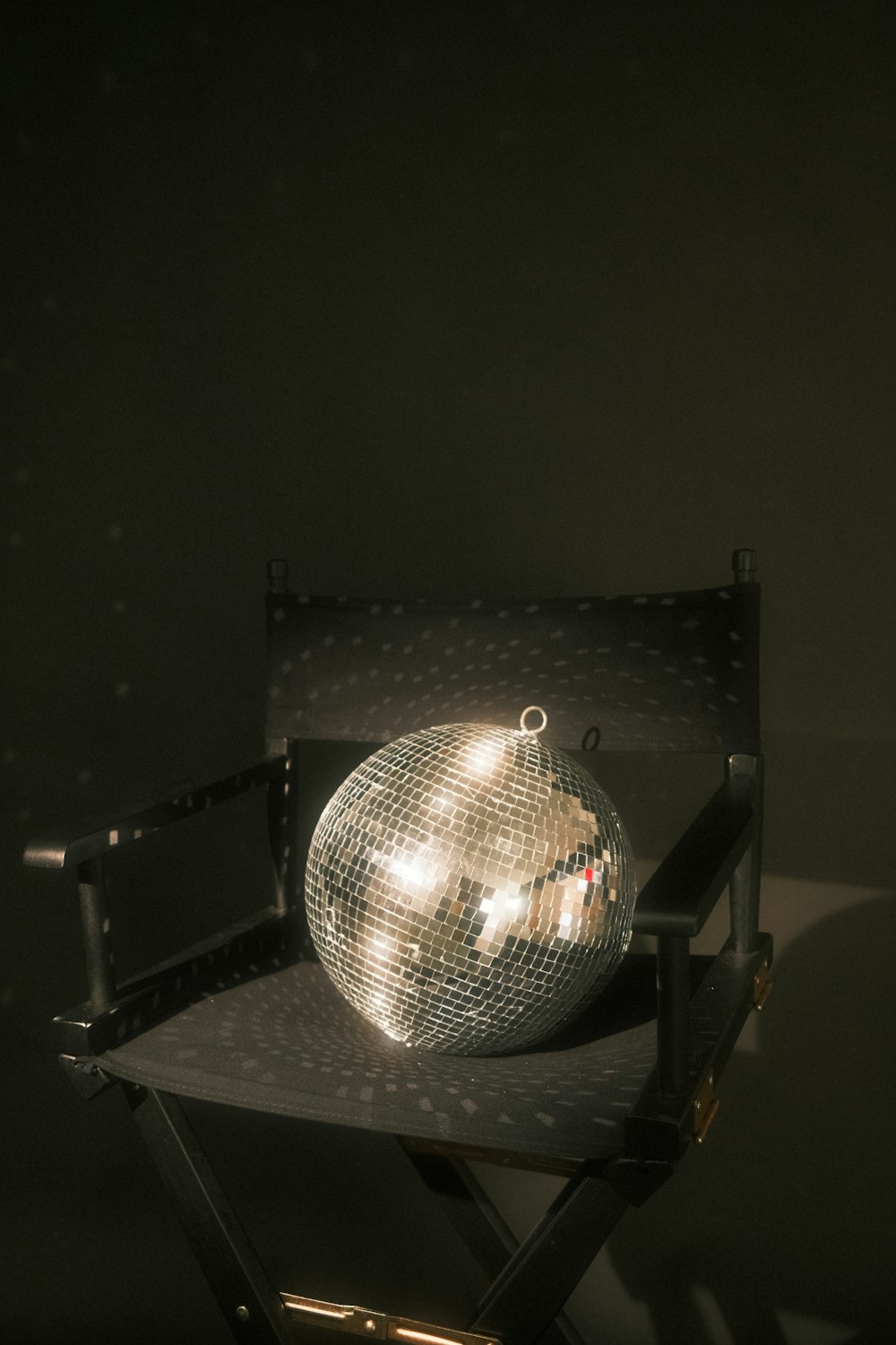 a disco ball sitting on top of a chair