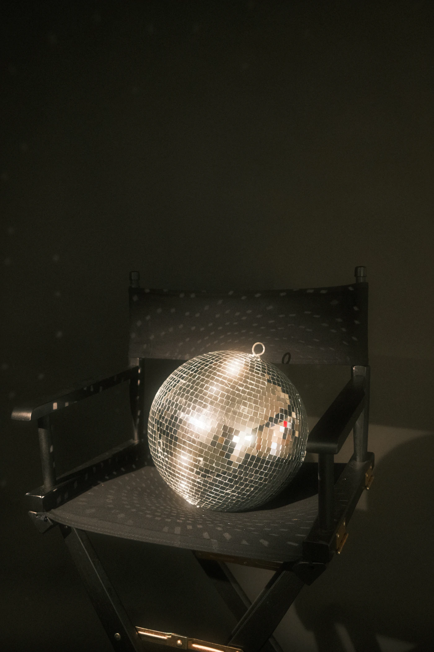 A disco ball waiting on a chair