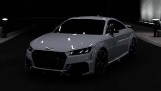 A sleek, high-end sports car parked on an urban street at dusk, illuminated by soft city lights reflecting off its polished surface.