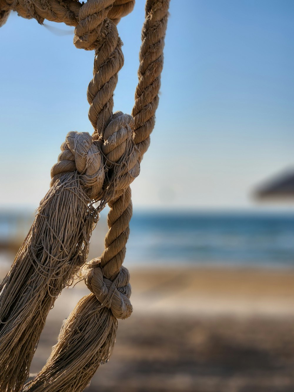 a close up of a rope on a beach